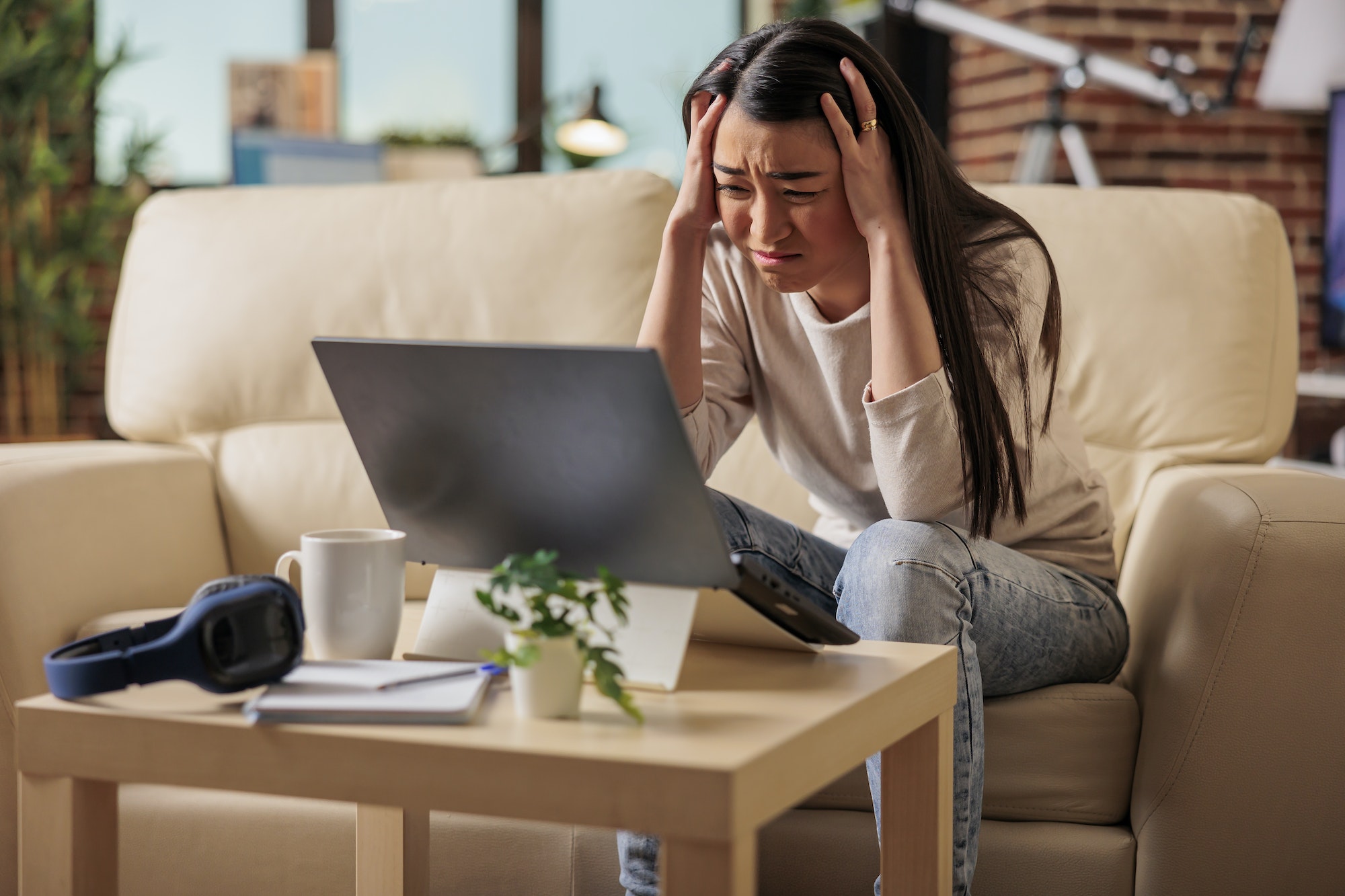 Young asian woman having migraine and headache